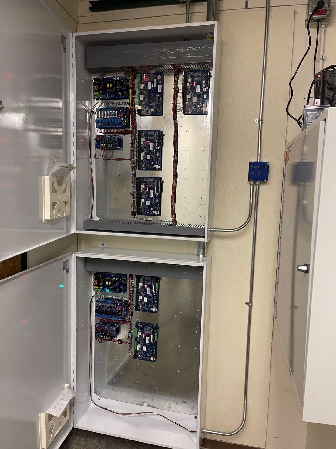 Commercial access-control and alarm panel cabinet wired and installed by Golden State Security Integrations
