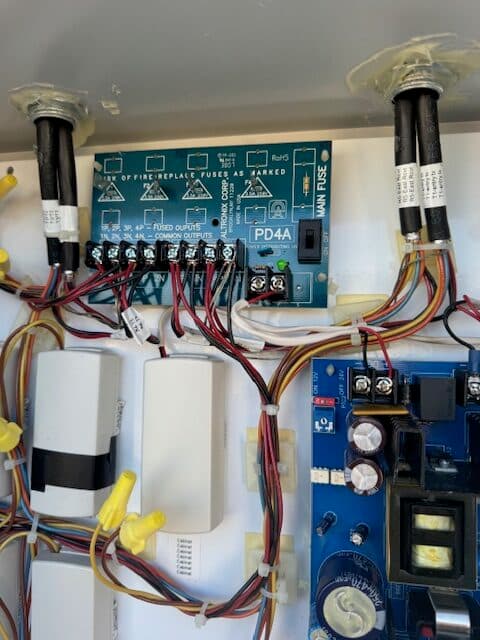 Commercial intrusion alarm panel with wired power distribution and backup